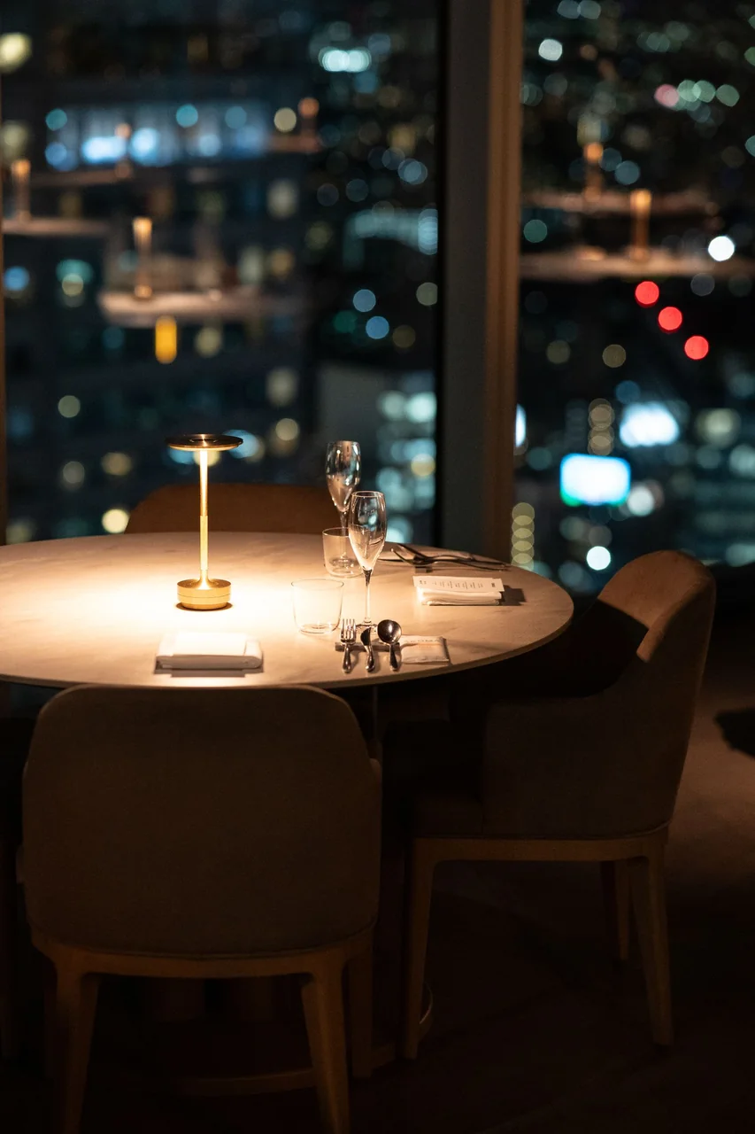 Fine dining restaurant interior with city view